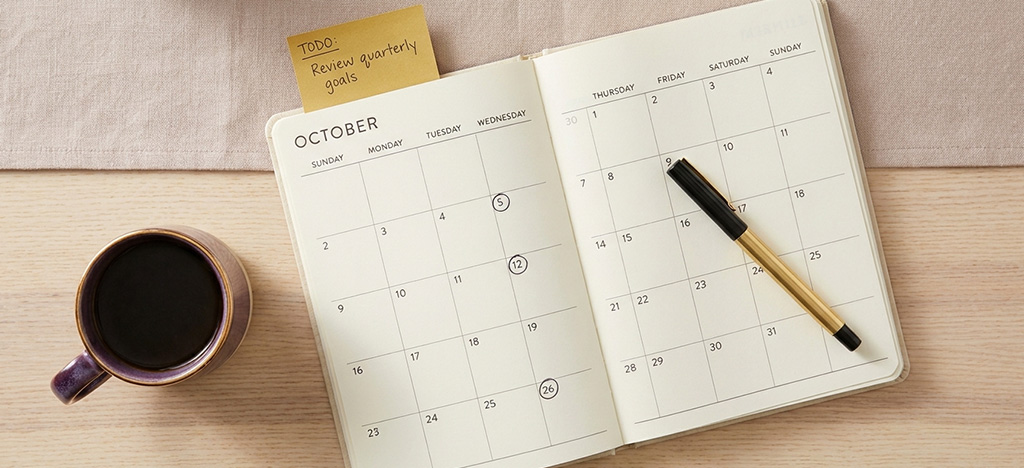 Open planner and calendar representing the right timing to request MBA sponsorship